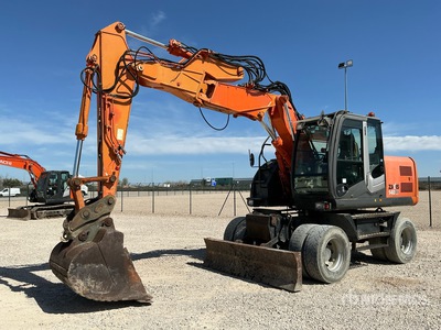 2009 Hitachi ZX140W-3 حفارة بعجلات