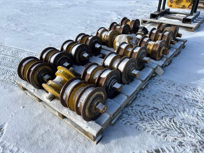 Quantity of (16) Cat D7 Rollers