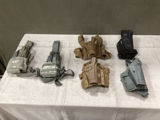 (25) Holsters, (5) Pistol Holster Carriers & Assorted Items (25) Holsters, (5) Pistol Holster Carriers & Assorted Items