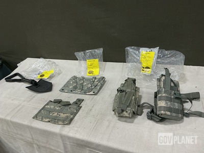 (1) Entrenching Tool, (8) M4 Three Mag Pouches & Assorted Items