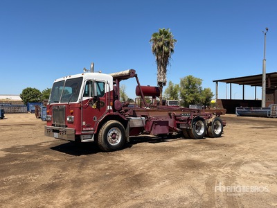 1999 Peterbilt 320 6x4 Roll-Off Truck
