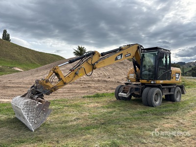 2011 Cat M313D حفارة بعجلات