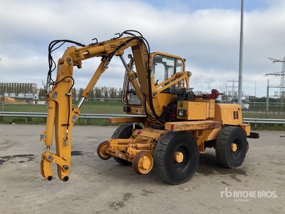 1994 Mecalac 11CX حفارة بعجلات