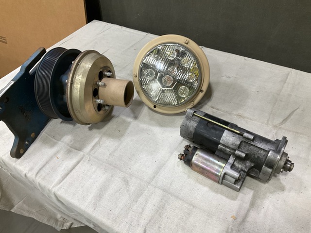 (1) Starter, (1) Engine Fan Clutch, (1) Headlight & Assorted Items