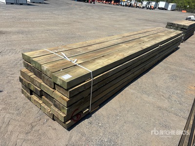 Quantity of 4 in x 10 in x 20 ft Surplus Pressure Treated Lumber