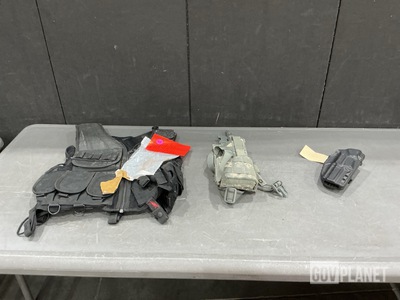 (27) Tactical Vests, (6) Assault Panels, (11) Assorted Holsters & Assorted Items