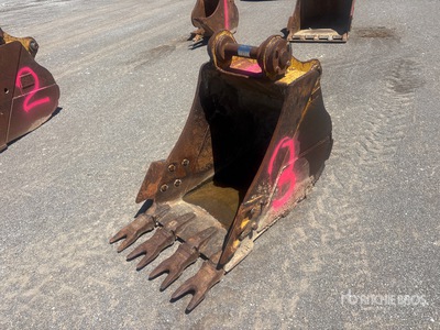 Cat 32 in Excavator Bucket