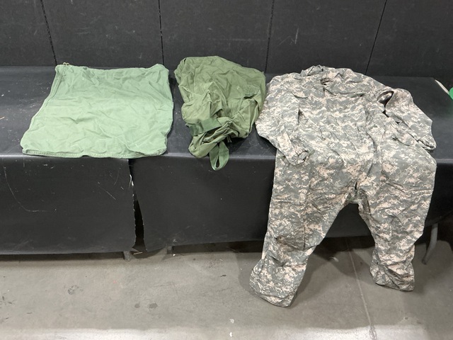 (52) Duffel Bags, (56) Barracks Bags, (2) Pairs of Coveralls & Assorted Items