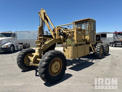 Hydraulic Arm Brush Cutter on Cat 120B Motor Grader