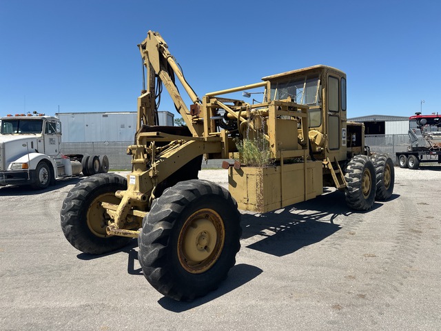 Hydraulic Arm Brush Cutter on Cat 120B Motor Grader