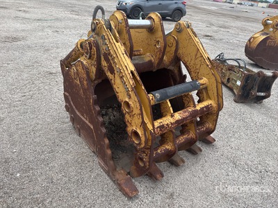Cat 47 in Digging Excavator Bucket