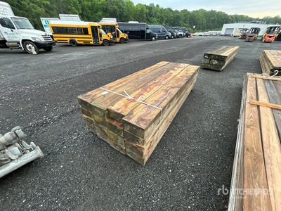 Quantity of (16) Surplus Pressure Treated Lumber 6 in x 12 in x 10 ft Tablas de madera