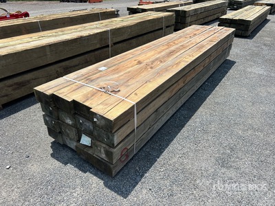 Quantity of (16) Surplus Pressure Treated Lumber 6 in x 10 in x 14 ft Tablas de madera
