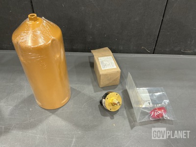 (7) Fluid Filter Elements, (15) Check Valves, (1) Valve Bushing & Assorted Items