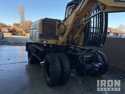 1999 Cat M312 Escavatore gommato