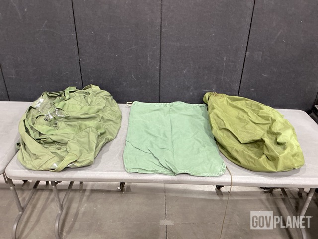 (76) Clothing Bags, (34) Barracks Bags, (51) Duffel Bags & Assorted Items