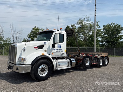 2022 Peterbilt 567 8x4 Tri/A Roll-Off Truck