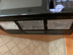 Interior with Stove Hood Exhaust Fan and Vent Cover