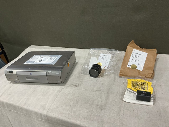 (1) Digital Video Cassette Recorder, (1) Camera Lens & Assorted Items