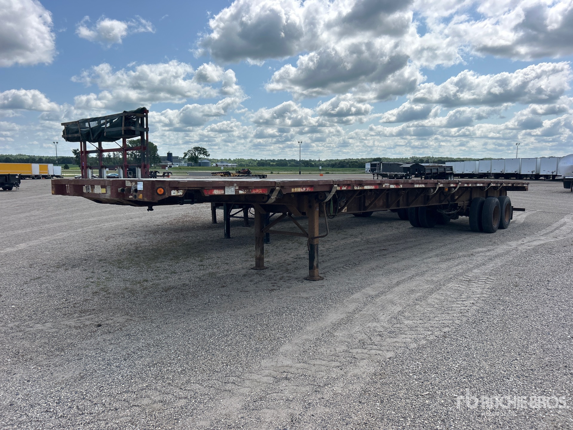 1999 Fontaine TP-4-4880SL 48 ft T/A 48 ft - 80 ft Extendable Flatbed Trailer