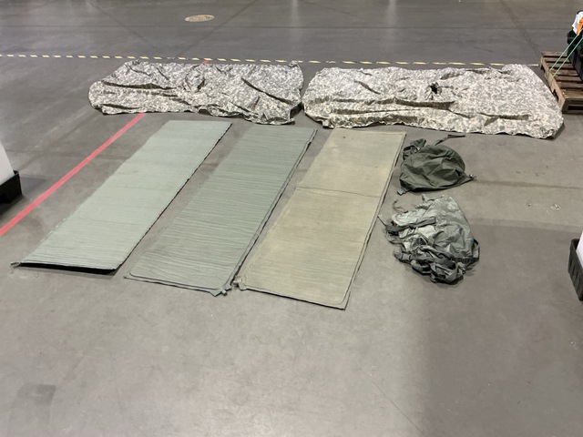 (23) Self-Inflating Sleeping Mats, (27) Wet Weather Ponchos & Assorted Items
