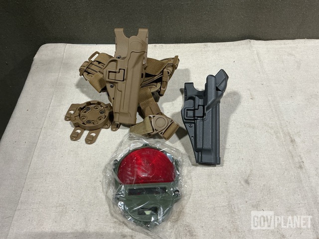 (2) Mechanical Pullers, (22) Individual Holsters & Assorted Items