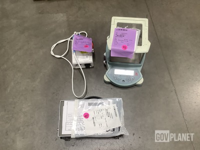 (1) Obturation Delivery System, (1) Voltmeter, (1) Balance & Assorted Items