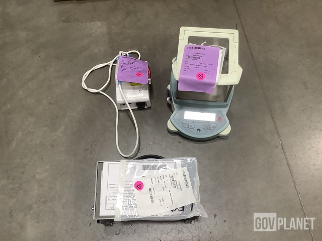 (1) Obturation Delivery System, (1) Voltmeter, (1) Balance & Assorted Items