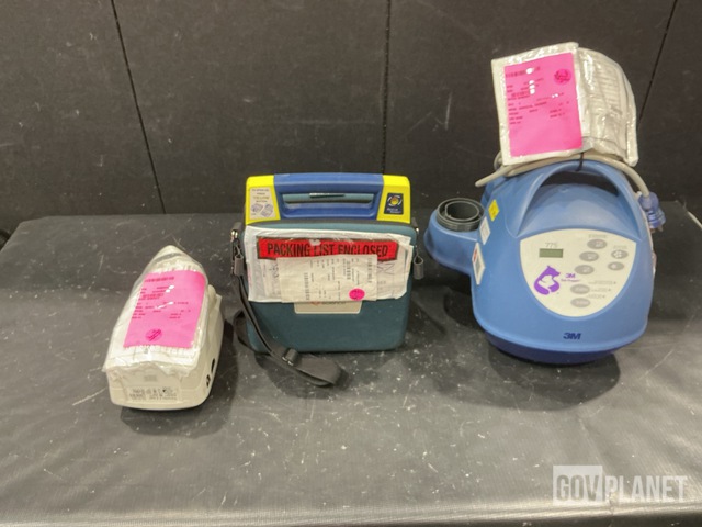 (1) Warming Unit, (1) Defibrillator & Assorted Items