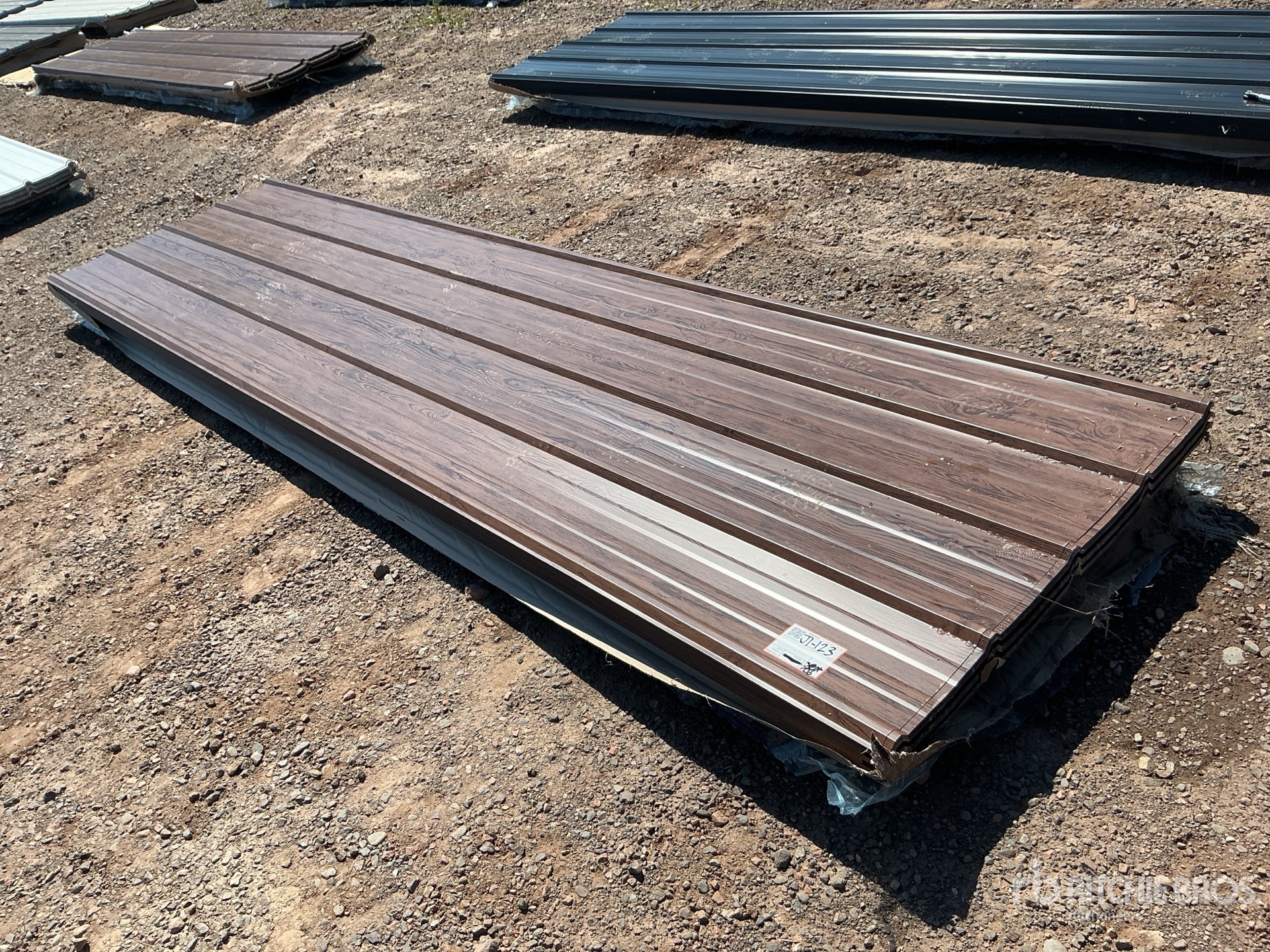 Quantity of (100) 12 ft x 3 ft Brown Metal Roof Panels (Unused)