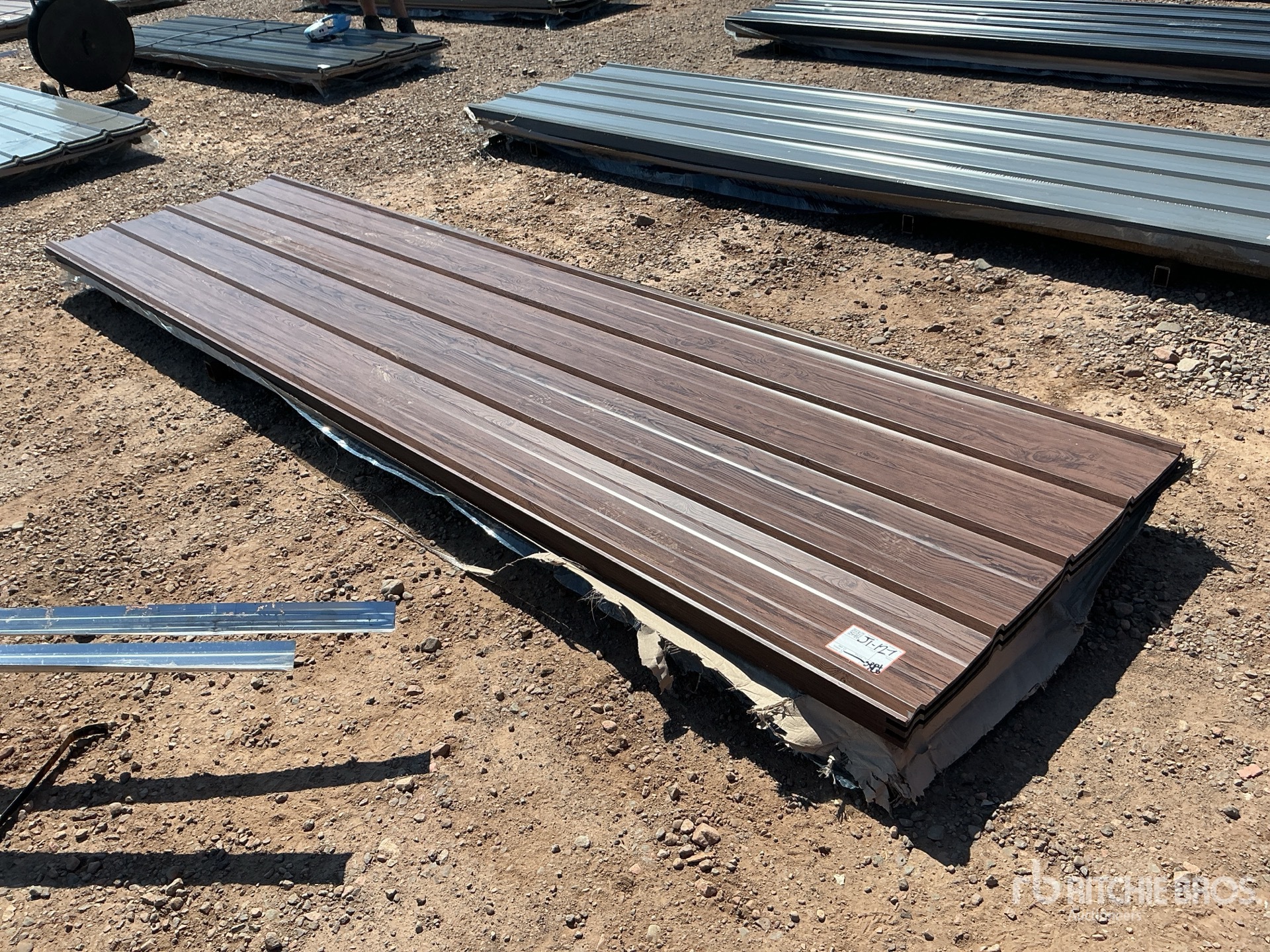 Quantity of (100) 12 ft x 3 ft Brown Metal Roof Panels (Unused)