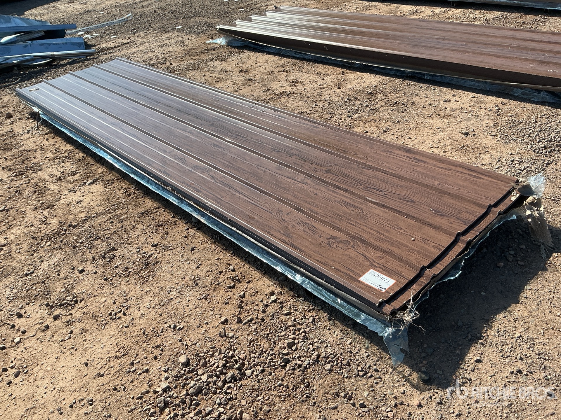 Quantity of (100) 12 ft x 3 ft Brown Metal Roof Panels (Unused)