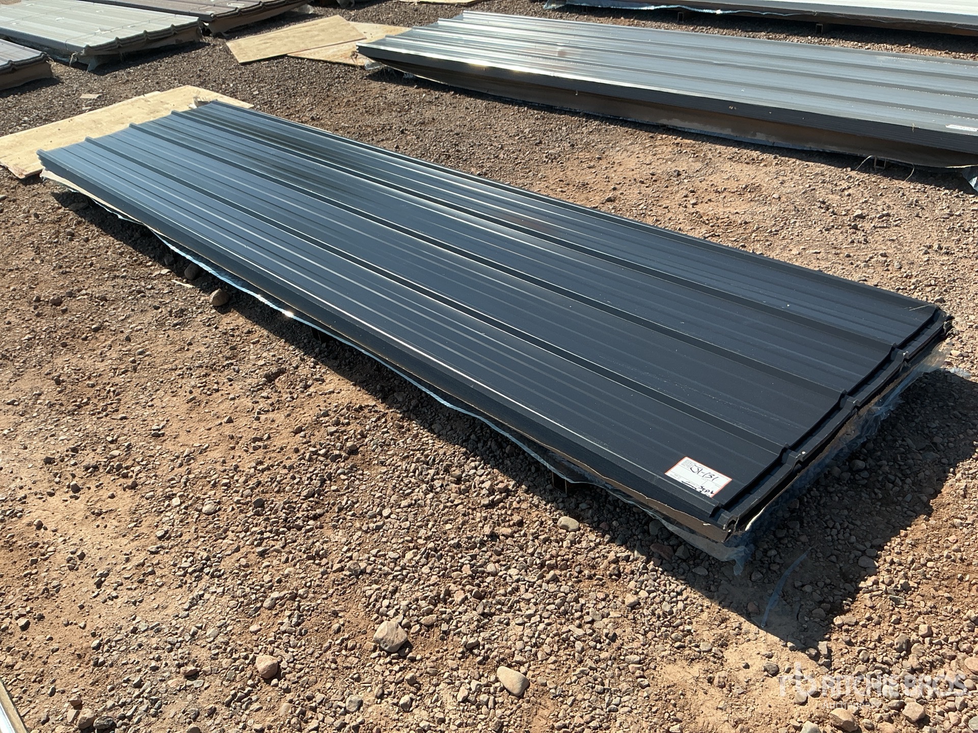 Quantity of (100) 12 ft x 3 ft Black Metal Roof Panels (Unused)