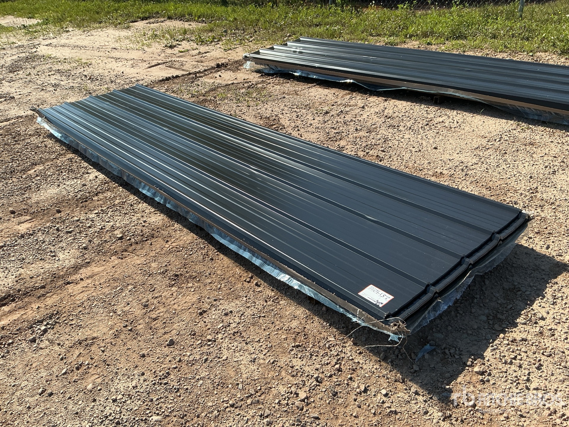 Quantity of (100) 12 ft x 3 ft Black Metal Roof Panels (Unused)