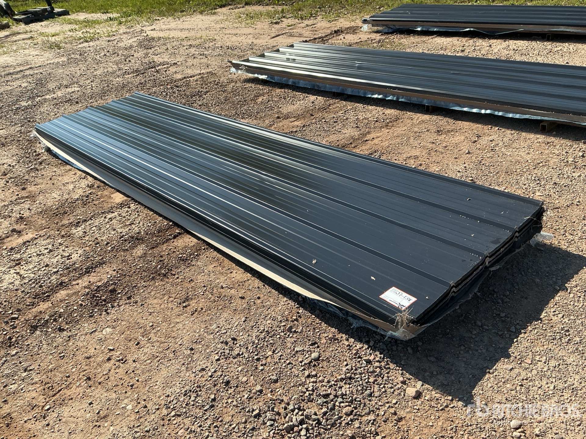 Quantity of (100) 12 ft x 3 ft Black Metal Roof Panels (Unused)