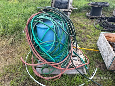 Quantity of Hoses and 50 gal Container