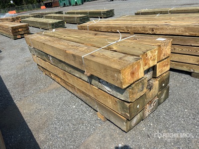Quantity of (12) 8 in x 12 in x 10 ft Surplus Pressure Treated Tablas de madera