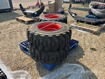 Quantity of (4) Skid Steer Tires & Rim Tires