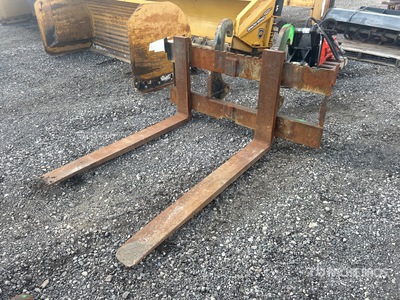 Cat 54 in Backhoe Forks