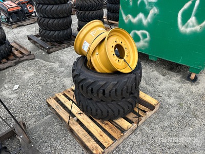 Quantity of (2) 10-16.5 Tires and Wheels for Cat Skid Steer Loader