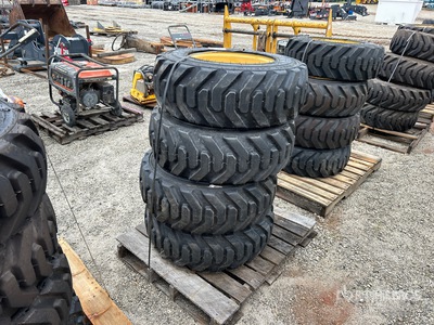Quantity of (4) 10-16.5 Tires and Wheels for Cat Skid Steer Loader