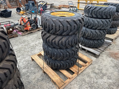 Quantity of (4) 10-16.5 Tires and Wheels for Cat Skid Steer Loader
