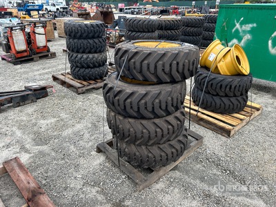 Quantity of (4) 10-16.5 Tires and Wheels for Cat Skid Steer Loader