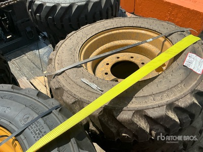 Quantity of (4) 10-16.5 Tires and Wheels for Cat Skid Steer Loader