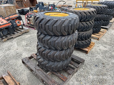 Quantity of (4) 10-16.5 Tires and Wheels for Cat Skid Steer Loader