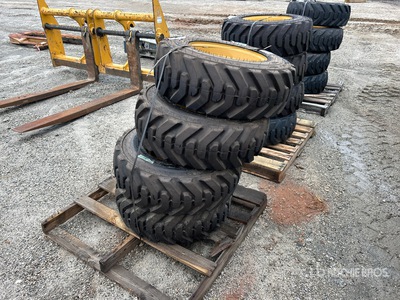 Quantity of (4) 10-16.5 Tires and Wheels for Cat Skid Steer Loader