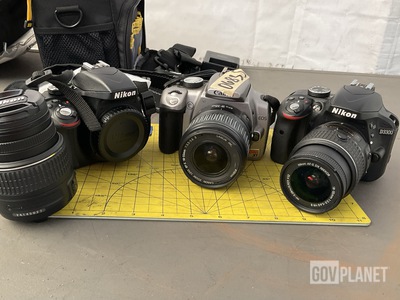 (2) Nikon Digital Cameras & (1) Canon Digital Camera