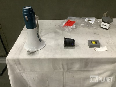 (2) Megaphone, (1) Low Speed Warning Device, (1) Lens & Assorted Items