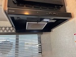 Interior with Stove Hood Exhaust Fan and Vent Cover