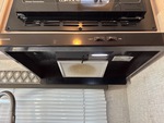 Interior with Stove Hood Exhaust Fan and Vent Cover